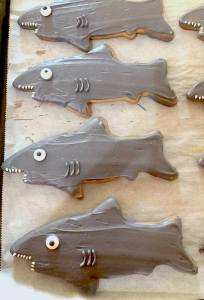 Photo of shark shaped and colored sugar cookies