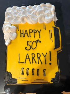 Photo of a beer pint shaped birthday cake with foam